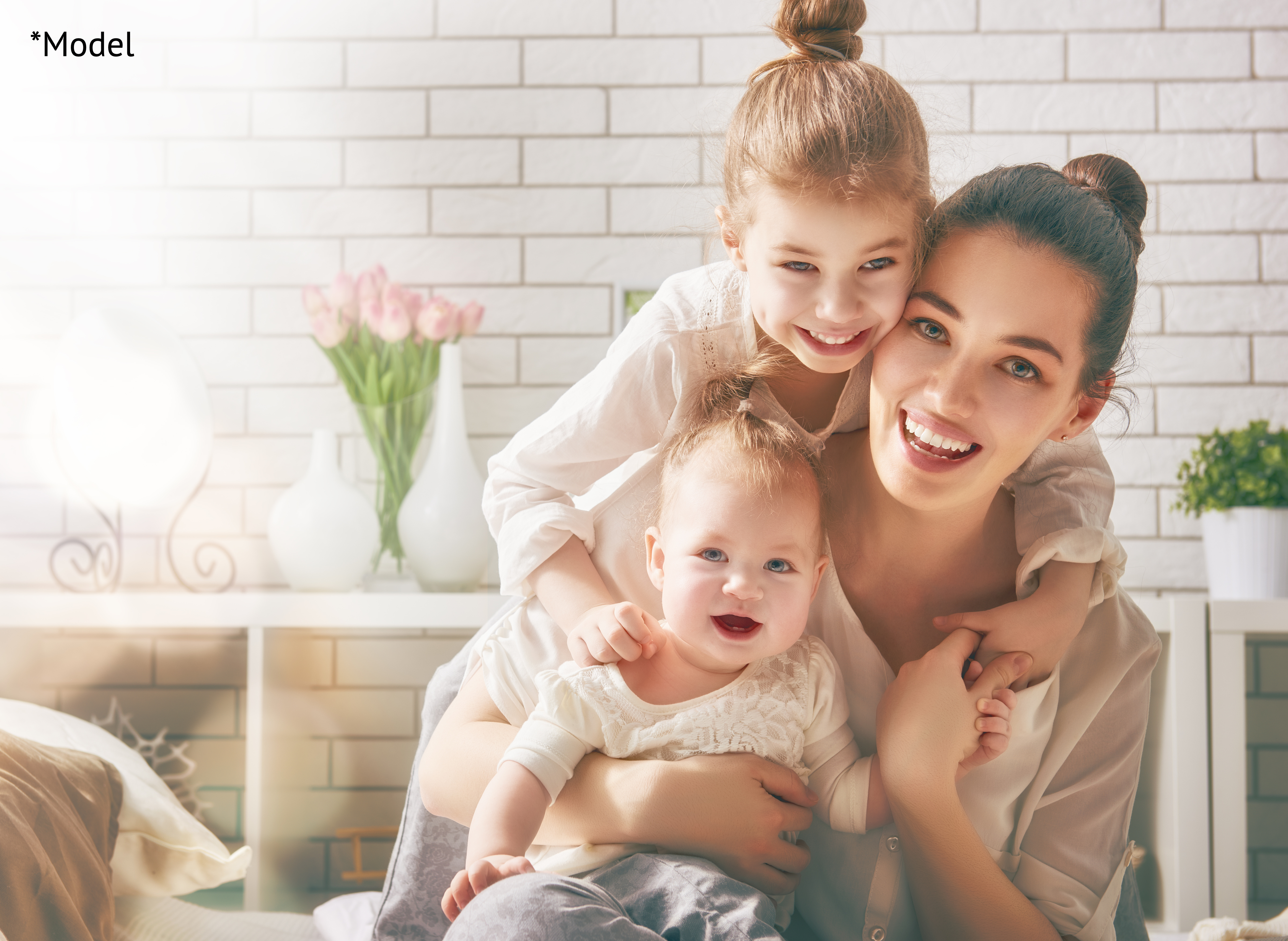 Happy mother with her two children all smiling