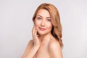 Middle aged woman maintains youthful face volume thanks to fat grafting to her face