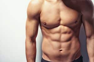 Male chest after gynecomastia surgery showing a flatter contour.